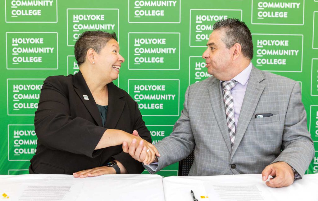 HCC President Christina Royal and AIC President Hubert Benitez sign an articulation agreement between the two schools June 23, 2022 at HCC.