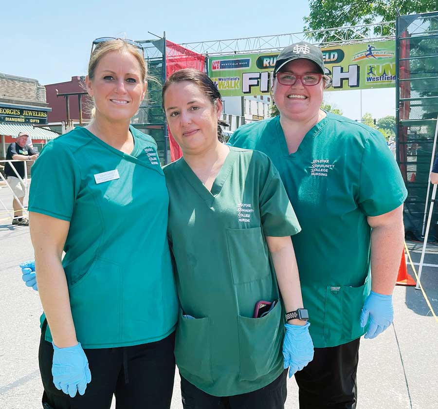 From left, HCC student nurses Laura Levin ’22, Shauna Martinez ’22, and Alison Hansen ’23 worked in the medical tent at the Run Westfield Flat & Fast 5k on May 22, 2022.