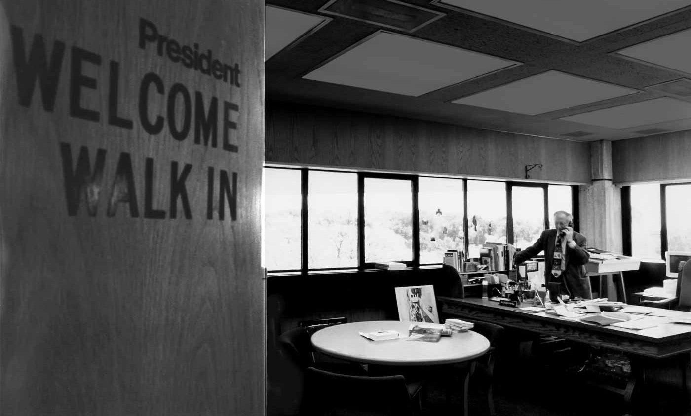 President David Bartley works the phone in his corner office overlooking the HCC campus.