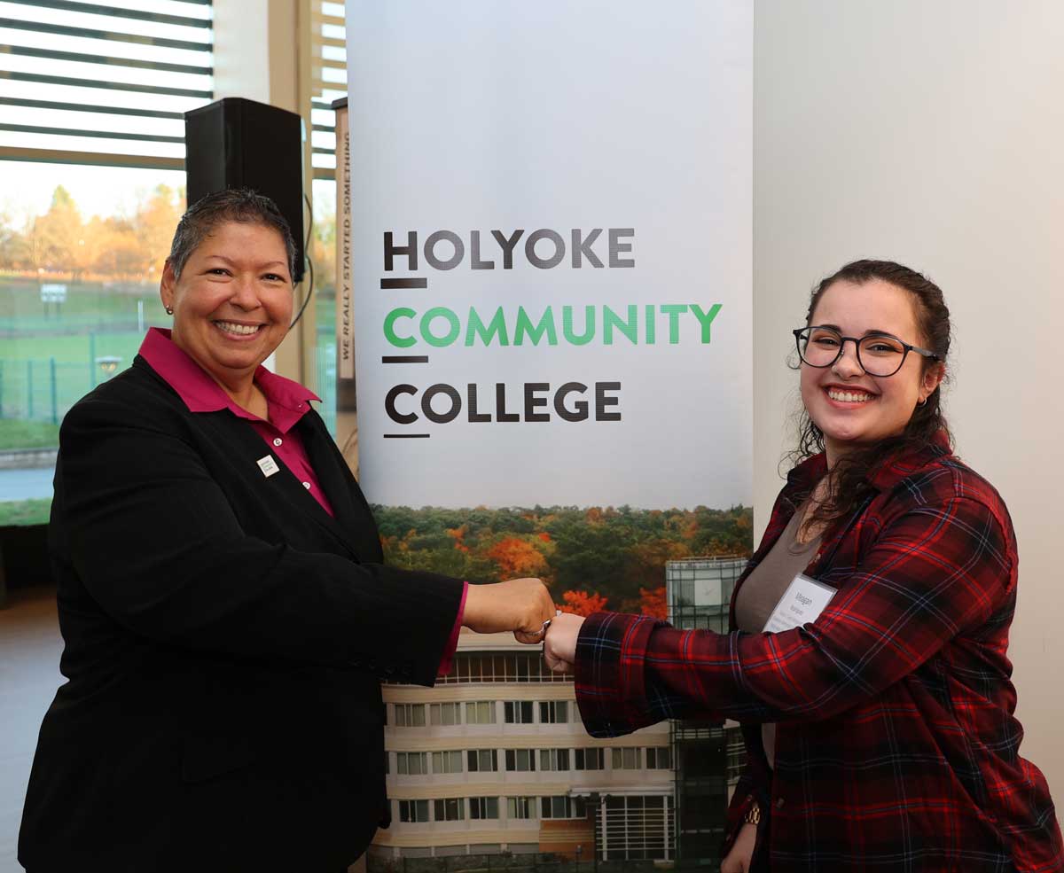 President Christina Royal bumps fists with student speaker Meagan Rodriguez at the HCC Foundation’s Nov. 9 scholarship reception.