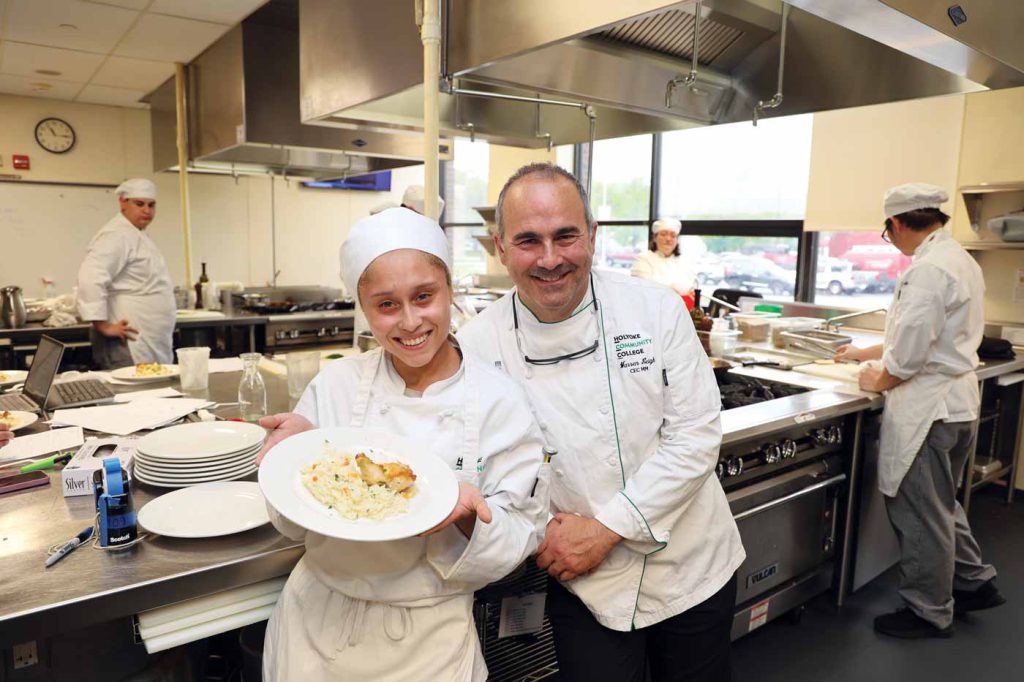 Chef Warren Leigh, right, with culinary arts student Sherleymary Santiago at the HCC MGM Culinary Arts Institute