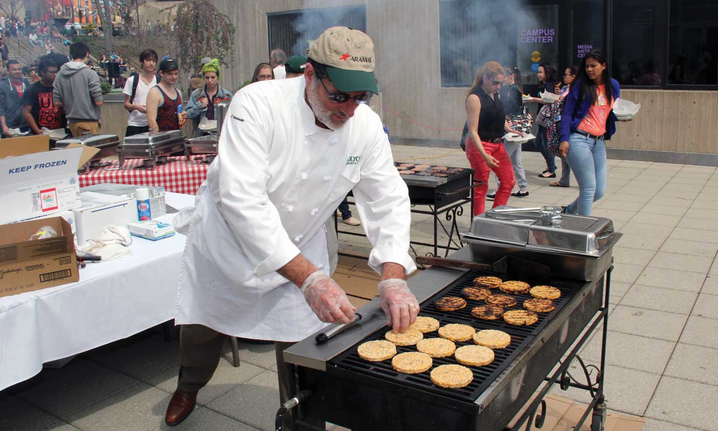 Mark Pronovost ’81 works a grill at Spring Fling