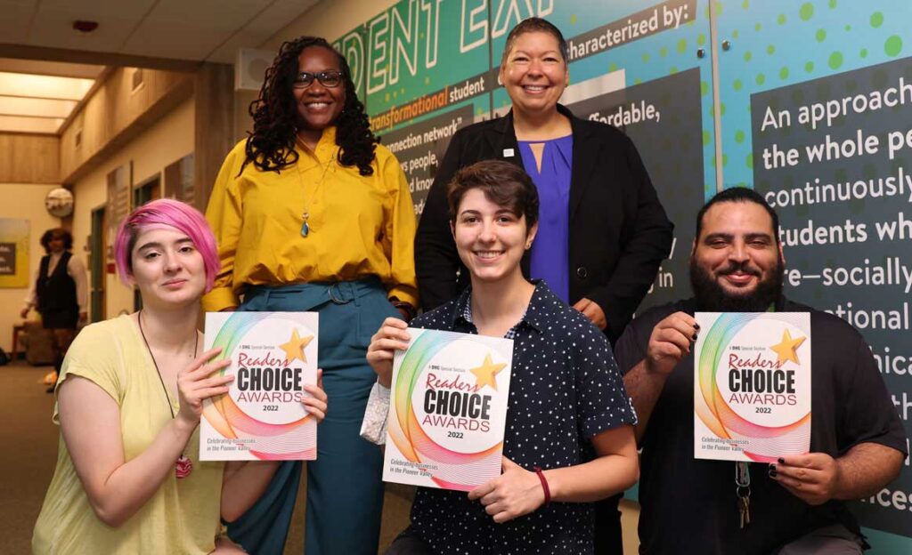 HCC students join Sharale Mathis, vice president of Academic & Student Affairs, back left, and President Christina Royal, to celebrate HCC's Readers Choice Award as the best two-year college for 2022.