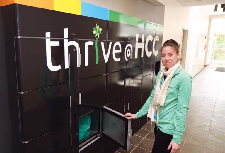Food pantry manager Elizabeth Eastman loads groceries into a refrigerated locker.