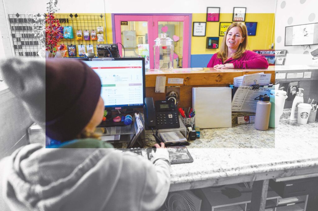 Staples consults with one of her 43 employees.