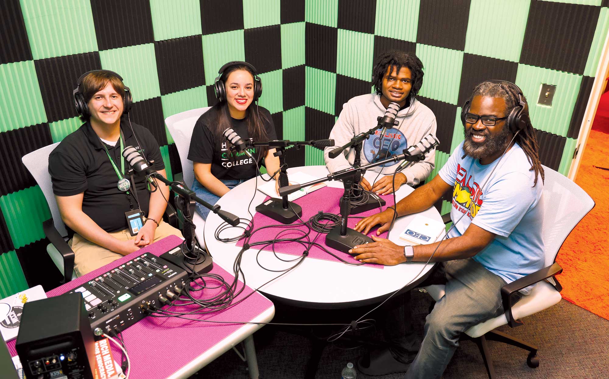 Green Thread co-hosts Patrick LaBelle, left, and Natalia Castagno get ready to record their interview with guests Mikey Connolly and his father, Myke Connolly ’04