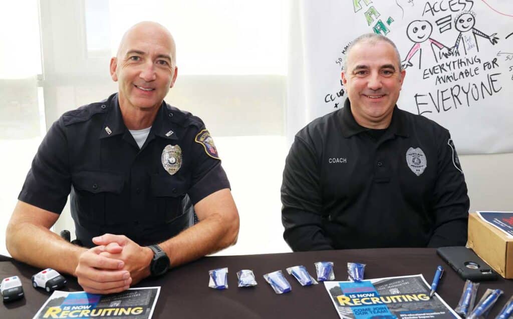 Westfield police officers John Blascak ’93, left, and Chris Coach ’97 at HCC’s fall community networking and internship fair