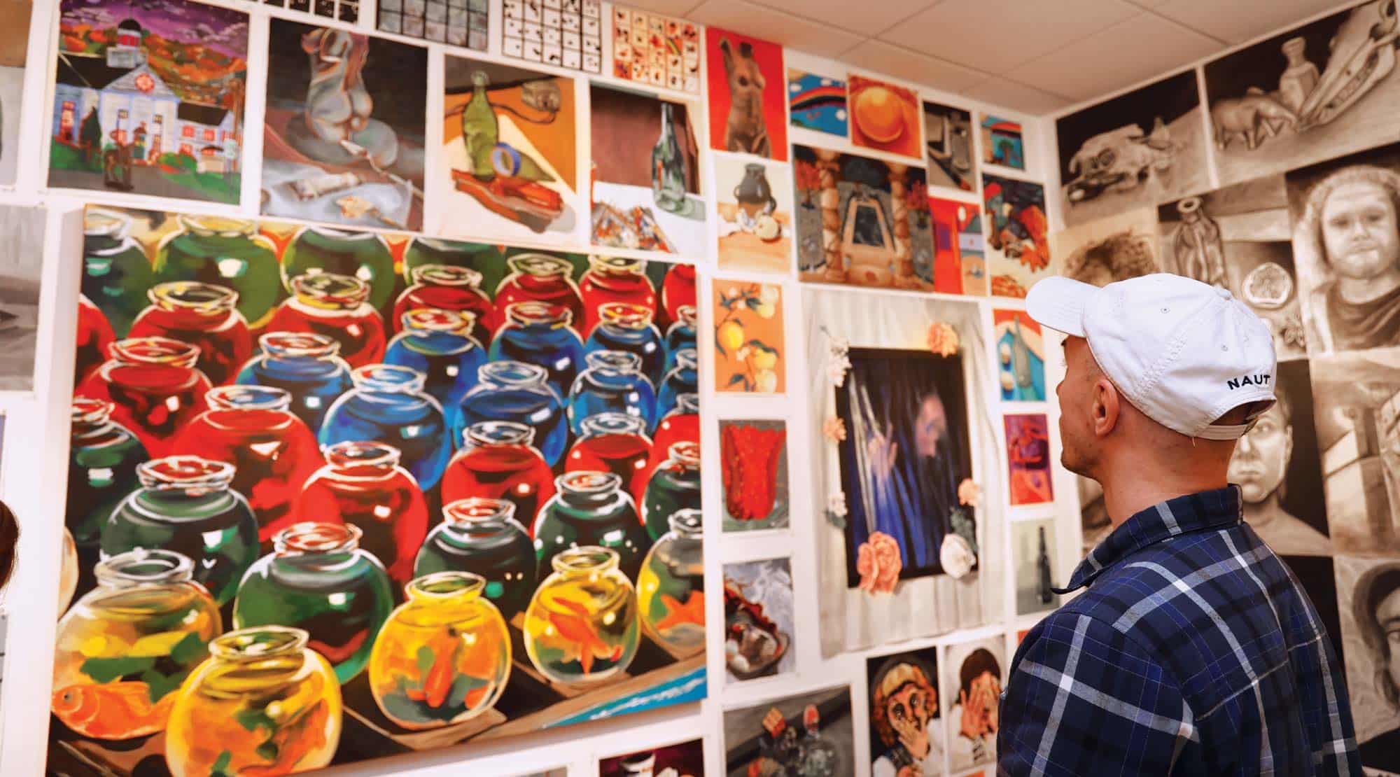 A gallery visitor views the annual Student Art Exhibition in 2023.